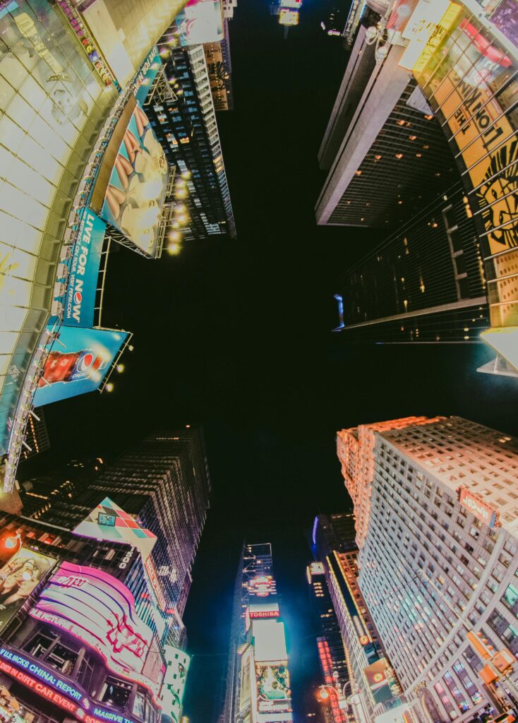 Stunning fisheye capture of Times Square's vibrant nighttime lights in New York City.